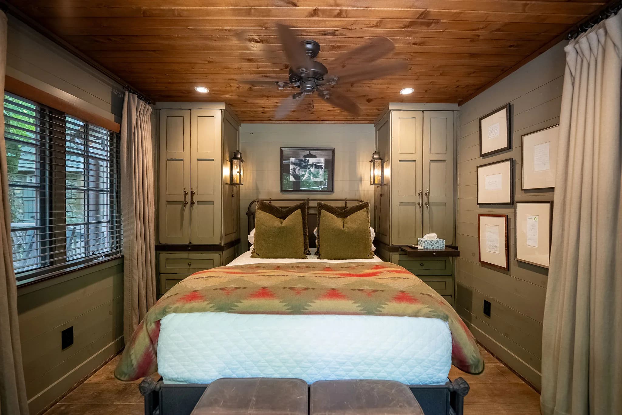 Queen bedroom with a wood plank ceiling in a riverfront cabin near Jones Gap State Park